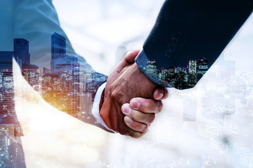 handshake, business deal, city-6701408.jpg